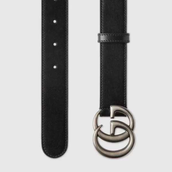 Close-up of Gucci GG Marmont Thin Black Leather Belt showcasing signature gold GG buckle detail