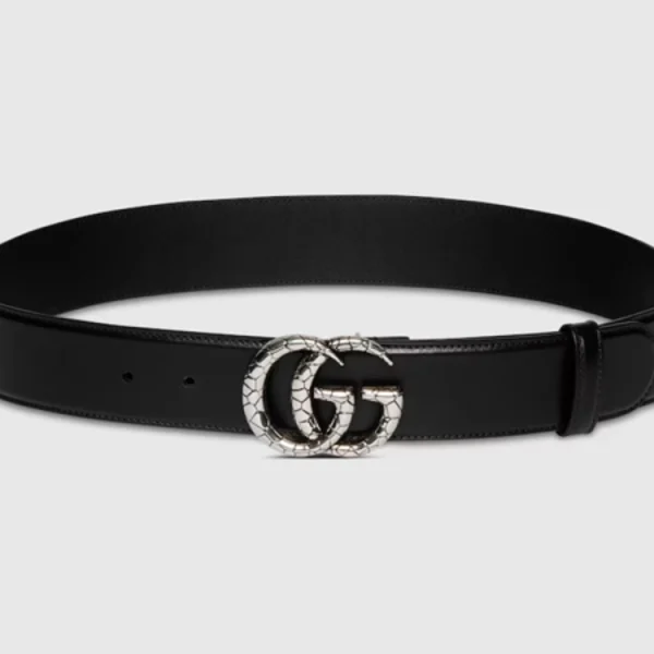 Gucci GG Marmont Wide Belt in black leather with antique gold double G buckle, styled on a clean white surface