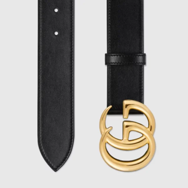 Close-up of Gucci GG Marmont Wide Black Leather Belt featuring polished gold GG buckle detail