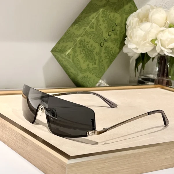 Gucci mask-shaped sunglasses with oversized shield lens and minimalist frame design