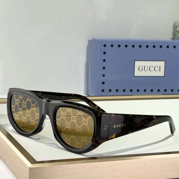 Gucci rectangular-frame sunglasses displayed on white tabletop, capturing luxury in minimalist style