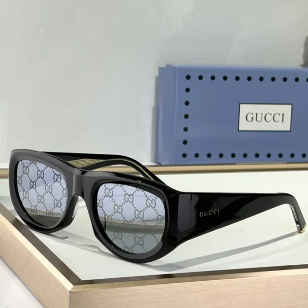 Side-angle view of Gucci rectangular sunglasses showcasing sleek arms with engraved GG logo