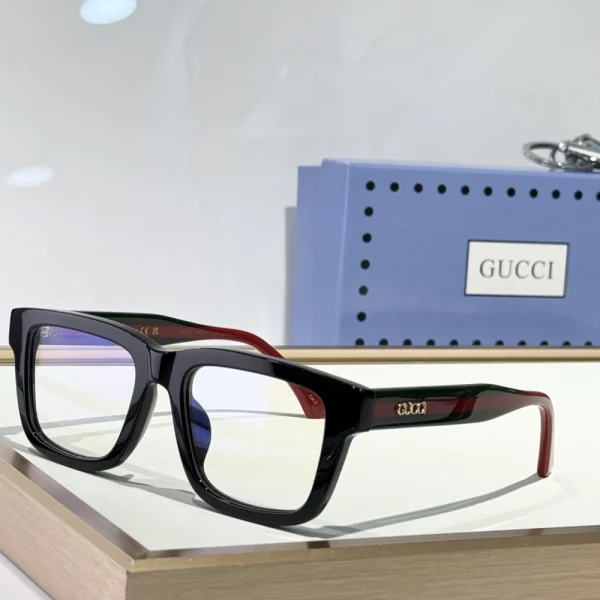 Lifestyle shot of Gucci rectangular sunglasses on marble surface, exuding premium aesthetic and detail