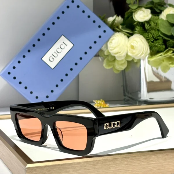 Angled view of Gucci GG-SG58 showing polished frame and dark tinted lenses