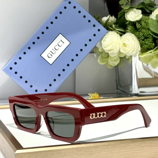 Gucci GG-SG59 rectangular sunglasses positioned diagonally on matte background for editorial look