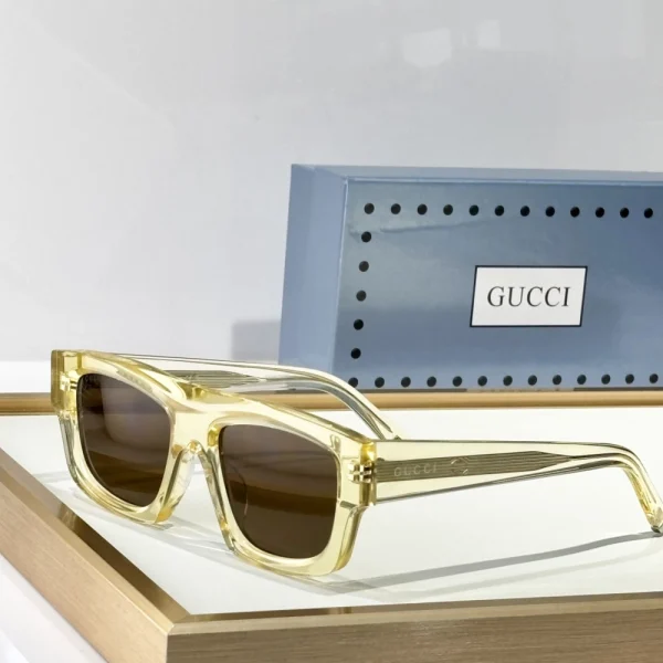 Close-up of Gucci Square sunglasses featuring thick acetate frame and subtle GG logo on temples