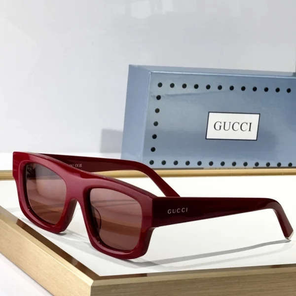 High-fashion Gucci square sunglasses in glossy black with structured frame and vintage vibe