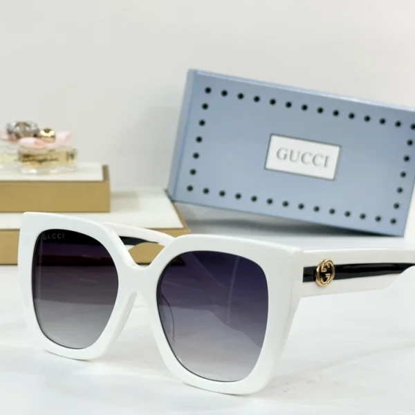 Close-up of Gucci Square sunglasses, showing textured acetate and signature interlocking GG logo