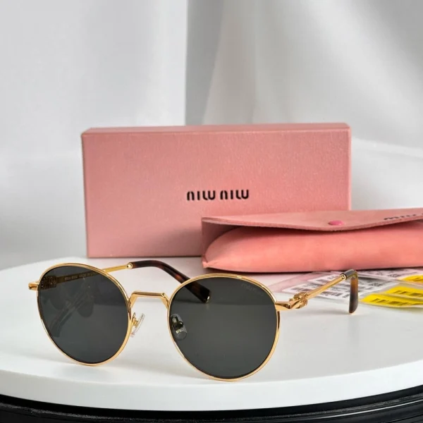 Front view of Miu Miu MM-SG65 sunglasses with signature logo detail and modern frame design