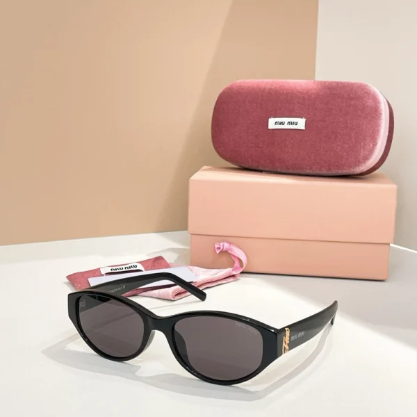 Miu Miu sunglasses with signature logo detailing and stylish frame design