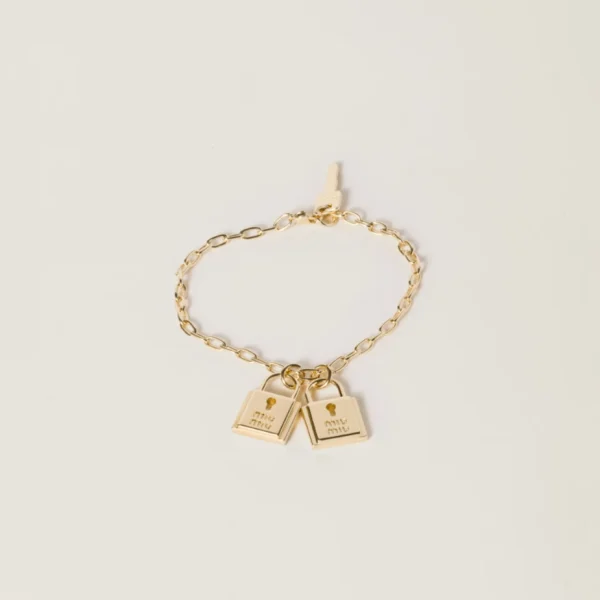 Miu Miu bracelet with charms featuring polished metal and decorative pendants