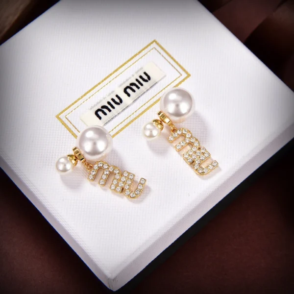 Miu Miu earrings featuring polished metal and elegant contemporary design