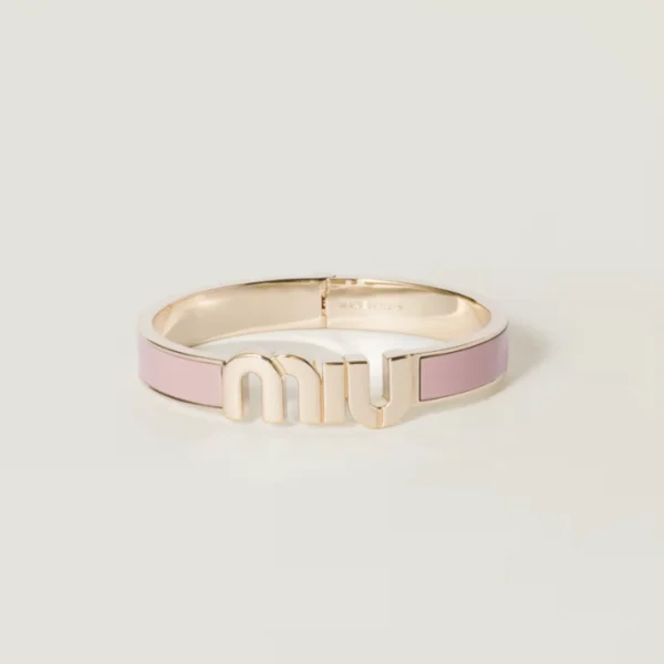 Orchid pink enameled metal bracelet by Miu Miu with glossy finish and elegant design