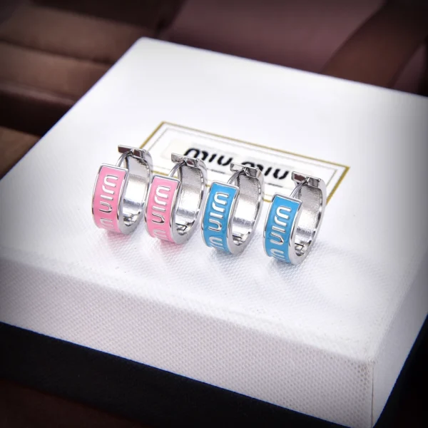 Miu Miu enameled metal earrings featuring glossy finish and modern design
