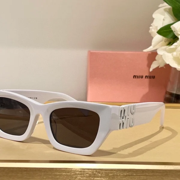 Close-up of Miu Miu MM-SG33 Glimpse sunglasses with polished finish and designer silhouette
