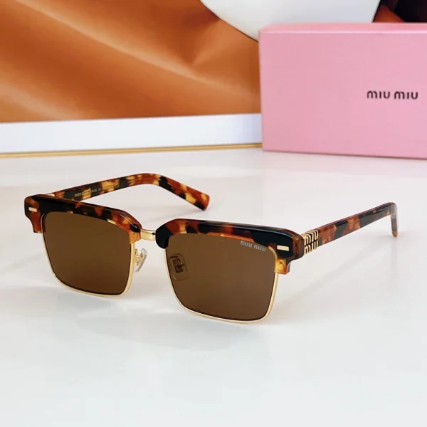 Miu Miu Logo browline sunglasses with contrast upper frame and metal rim detail, featuring signature logo on the arms
