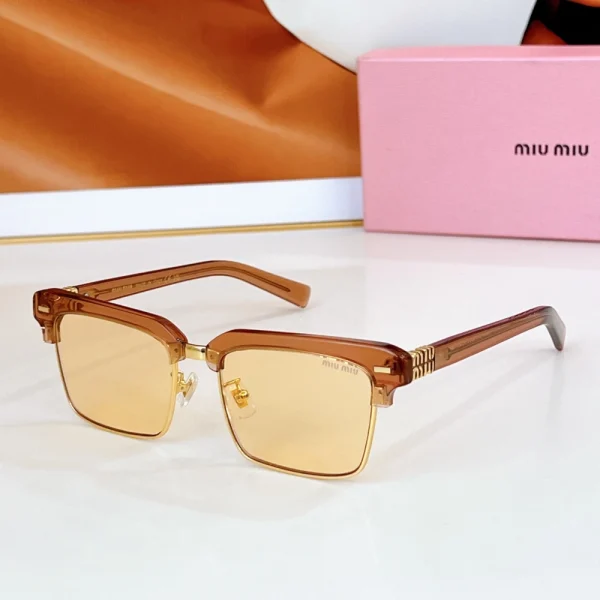 Bold browline sunglasses by Miu Miu, combining vintage charm with luxury logo accents