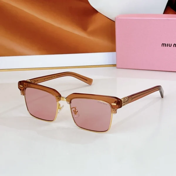 Luxury Miu Miu browline sunglasses with iconic logo and sleek, modern finish