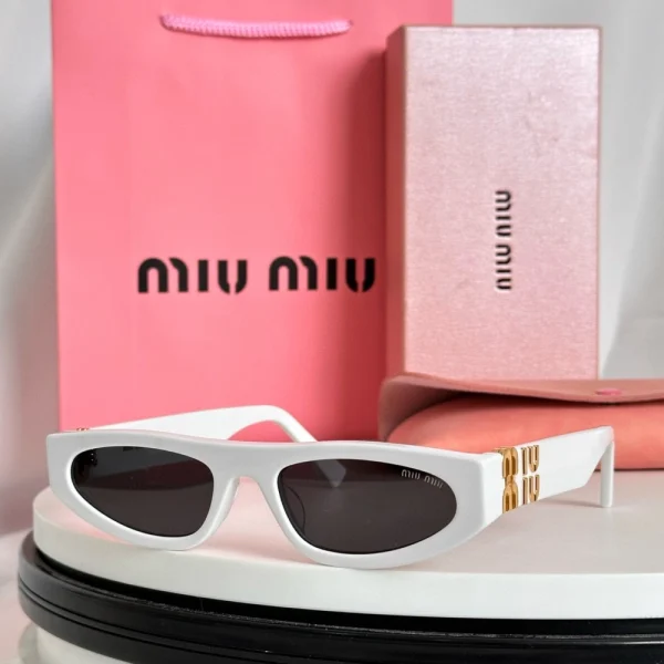 Miu Miu Logo cat-eye sunglasses with sharp angular frame and bold branding on the temples