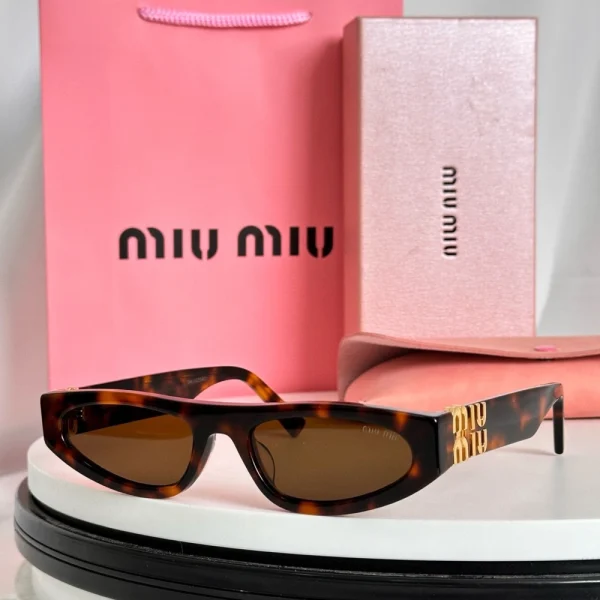 Statement cat-eye sunglasses by Miu Miu featuring sculpted edges and signature logo detail