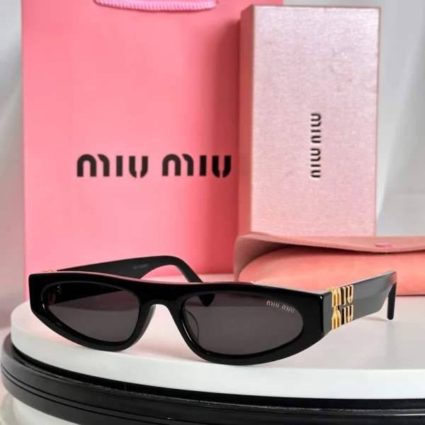 Luxury Miu Miu cat-eye sunglasses with logo accent and vintage-inspired silhouette