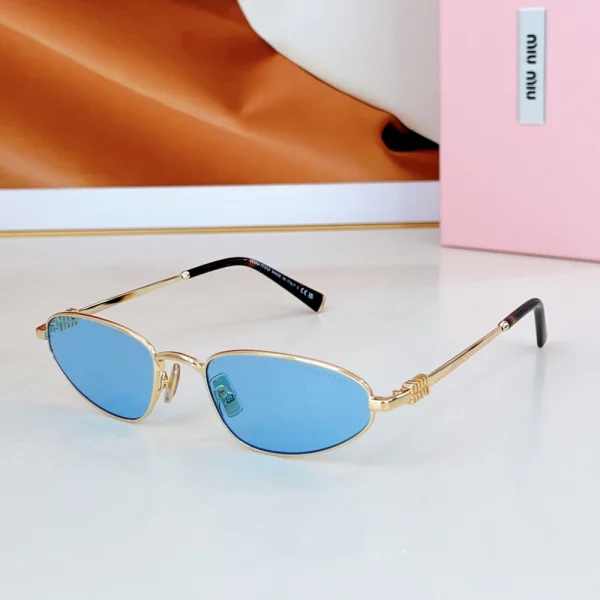 Miu Miu oval sunglasses crafted with high-gloss acetate and finished with signature logo on both temples