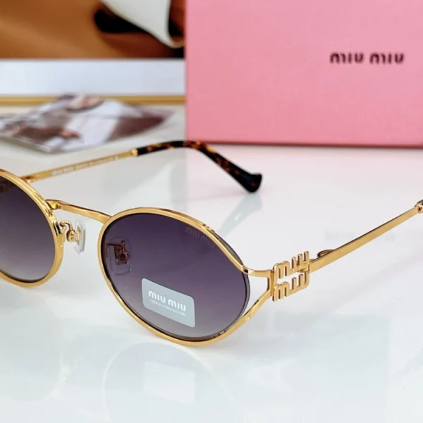 Miu Miu logo sunglasses featuring signature branding on temples and gradient lenses