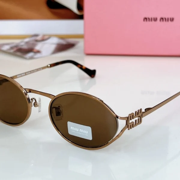 Close-up of Miu Miu MM-SG25 sunglasses with bold logo detail and sleek modern frame