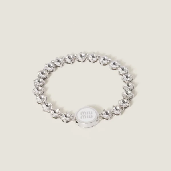 Chic Miu Miu metal bracelet styled with contemporary fashion outfit