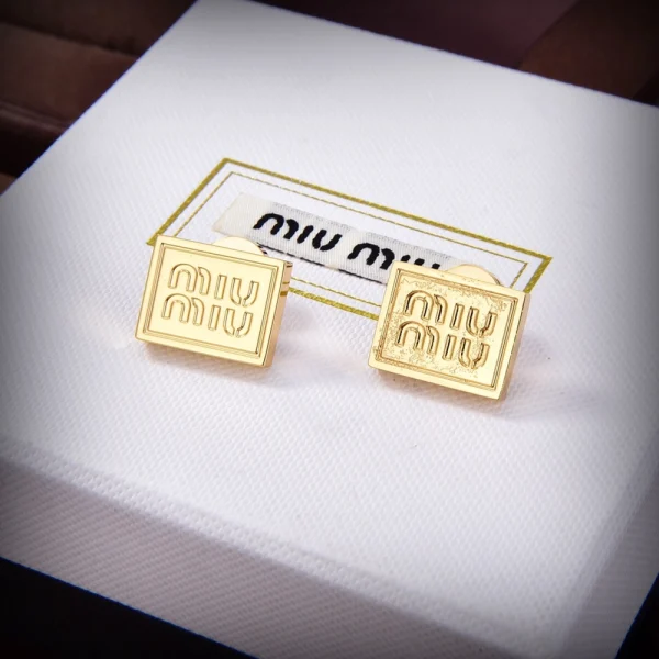 Miu Miu gold metal earrings with polished finish and elegant minimalist design