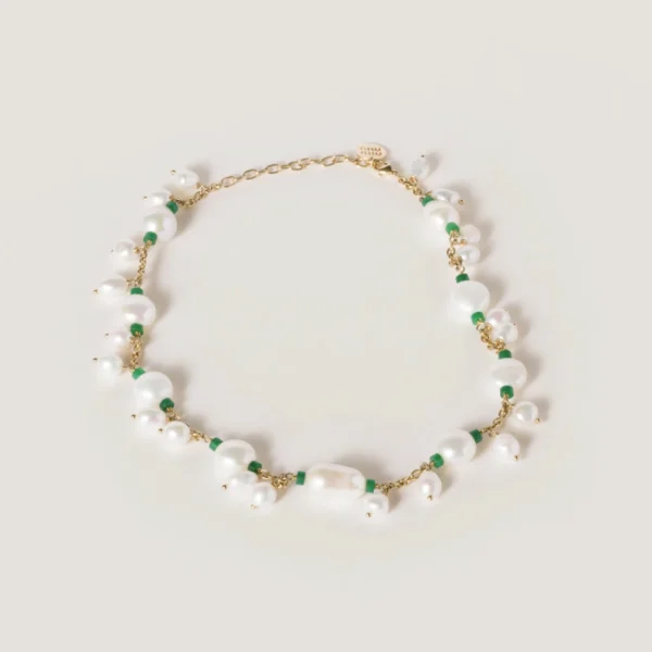 Miu Miu metal necklace featuring gold-tone chain, pearl details, and jade accents