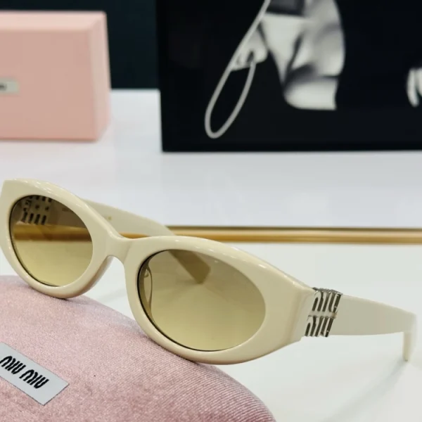 Elegant Luxury Miu Miu Glimpse sunglasses styled with a high-fashion outfit