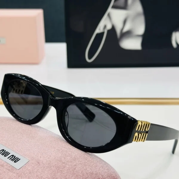 Close-up of Luxury Miu Miu Glimpse sunglasses with polished finish and angular design
