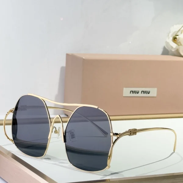 Miu Miu Miu ombre sunglasses featuring gradient lenses and modern oversized frame