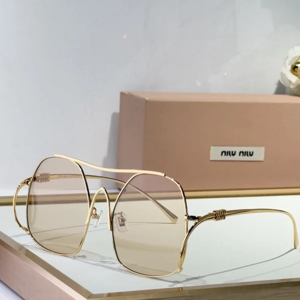 Stylish Miu Miu Miu ombre sunglasses worn with a contemporary fashion outfit