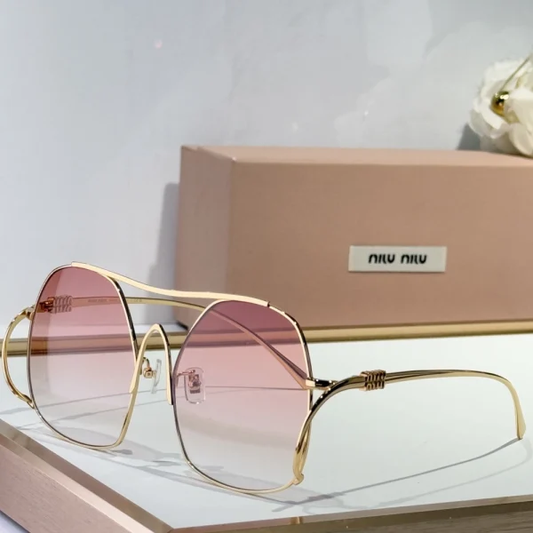 Close-up of Miu Miu Miu sunglasses with ombre-tinted lenses and chic designer style