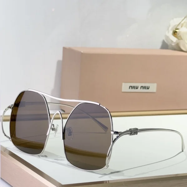 Luxury Miu ombre sunglasses featuring gradient lenses and sleek designer frame