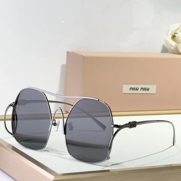 Luxury Miu Miu Miu ombre sunglasses featuring gradient lenses and elegant oversized frame