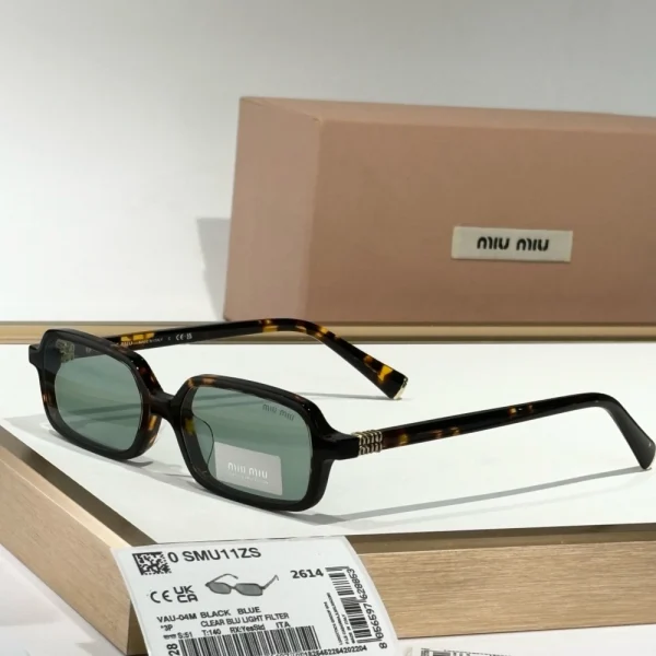 Miu Miu Miu Regard sunglasses featuring bold frame design and gradient tinted lenses