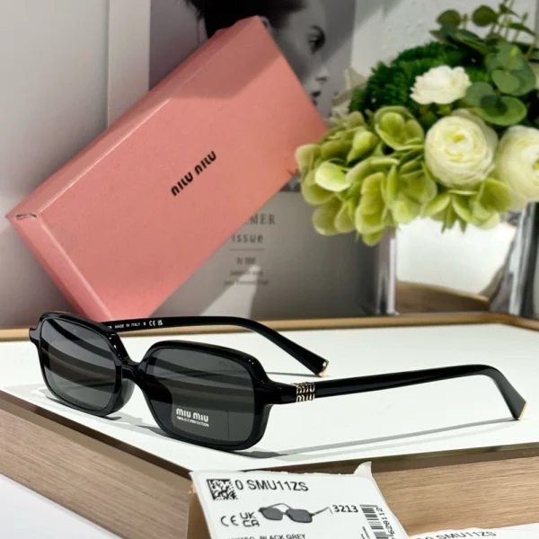 Side view of Miu Miu Miu Regard sunglasses MM-SG40 showcasing signature angled frame and tinted lenses