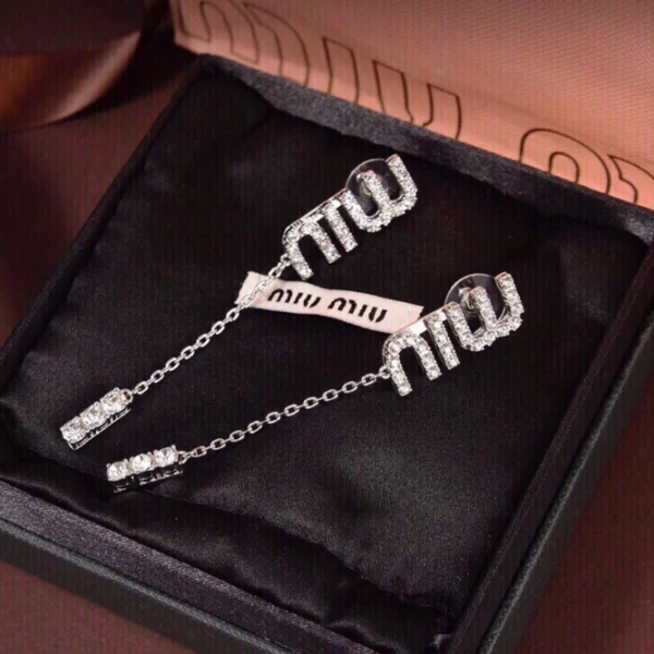 Miu Miu pendant earrings featuring sparkling crystals and elegant drop design