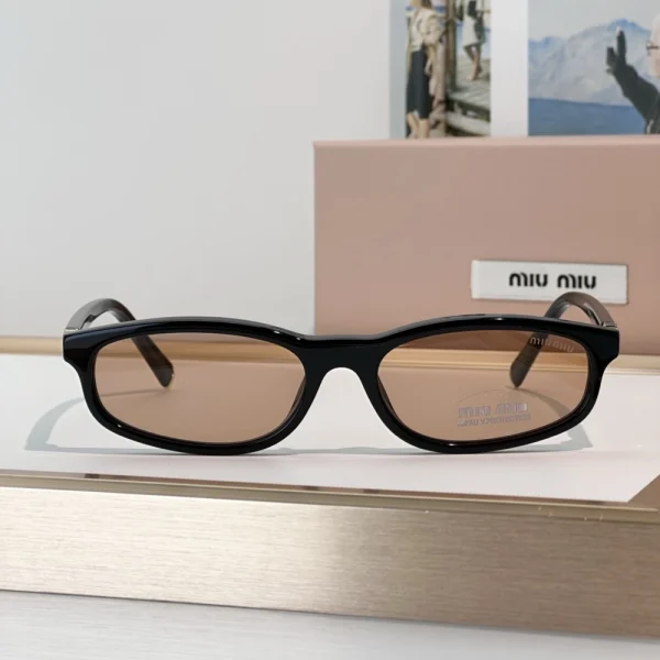 Miu Miu Regard sunglasses featuring bold geometric frame and gradient tinted lenses