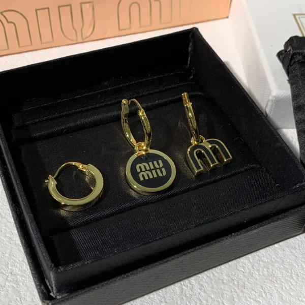 Set of Miu Miu enameled metal earrings featuring glossy finish and vibrant colors