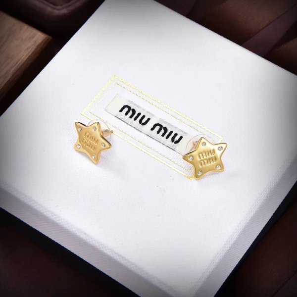 Miu Miu star earrings featuring polished metal and playful celestial design