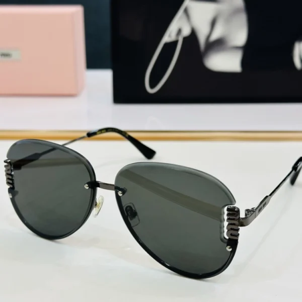 Elegant Miu Miu sunglasses resting on a white tabletop, highlighting the smooth finish and refined craftsmanship