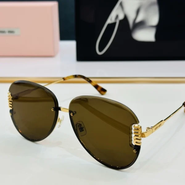 Close-up of luxury Miu Miu sunglasses on glossy white surface, capturing high-quality texture and polished details