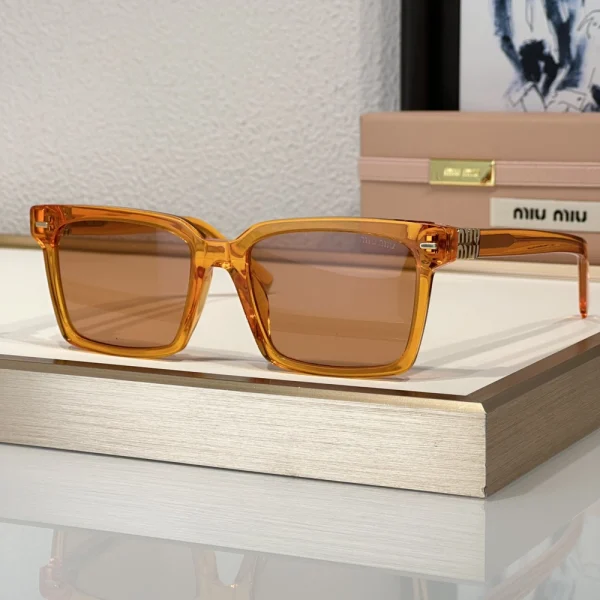 Miu Miu sunglasses crafted from premium acetate with luxe gold-tone logo accents