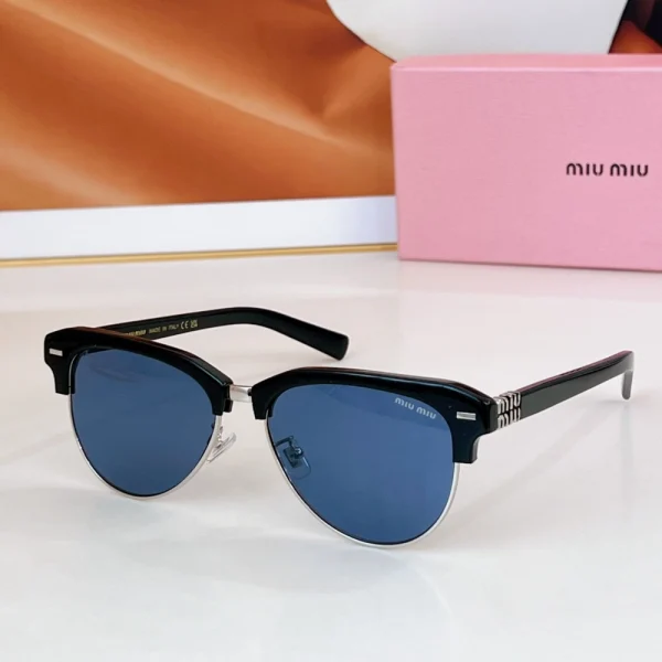 Luxury Miu Miu sunglasses displayed on a clean surface with signature box in soft focus behind
