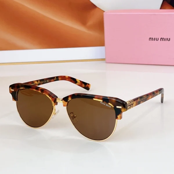 Flat lay of Miu Miu sunglasses in foreground with case placed at a distance for depth effect