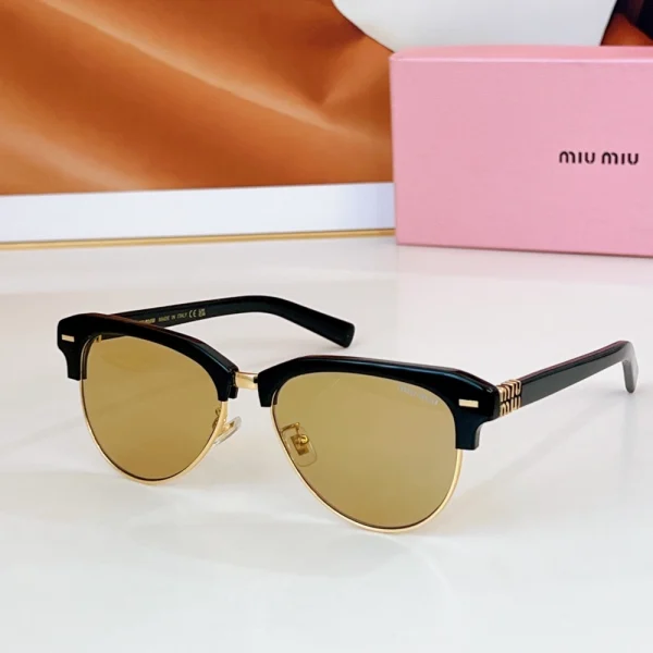 Miu Miu sunglasses catching natural light on table surface, with branded box subtly behind